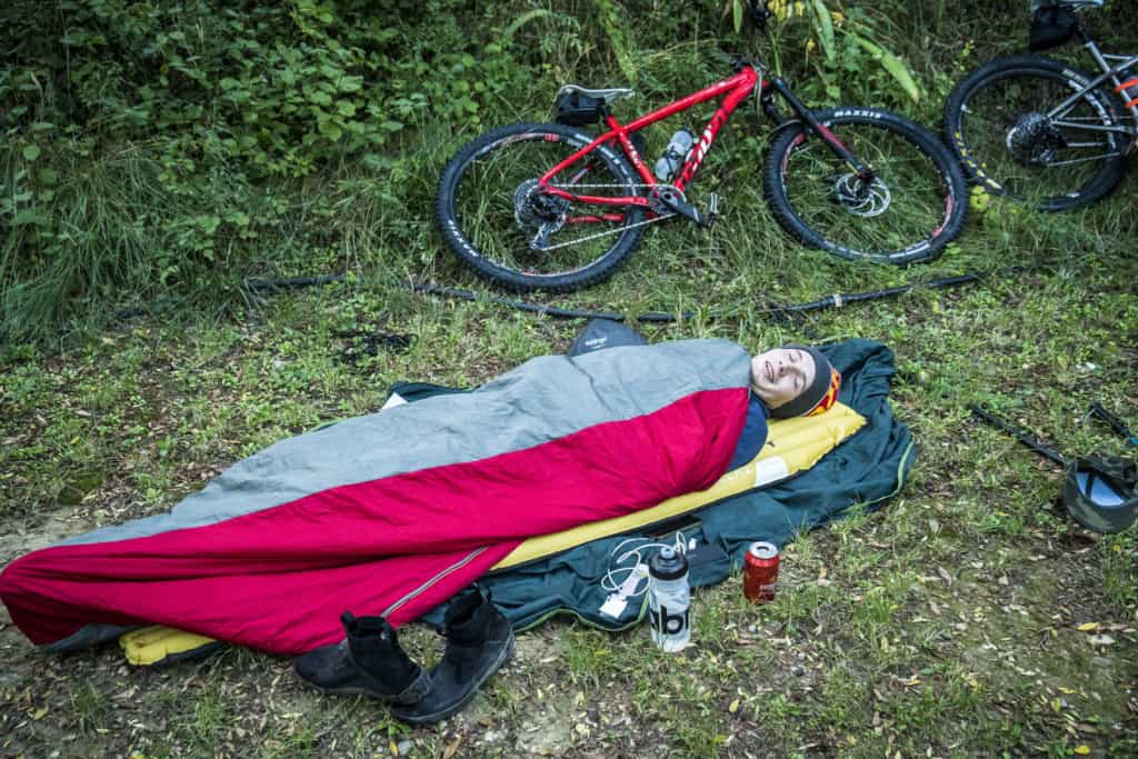 Ben camping on the ground with no tent