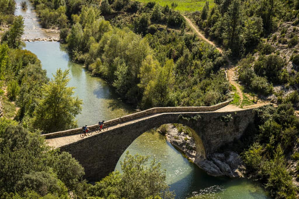 Crossing a narrow roman bridge over the River Alcanadre