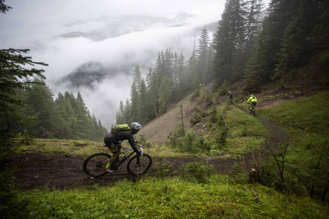 rider on muddy singletrack