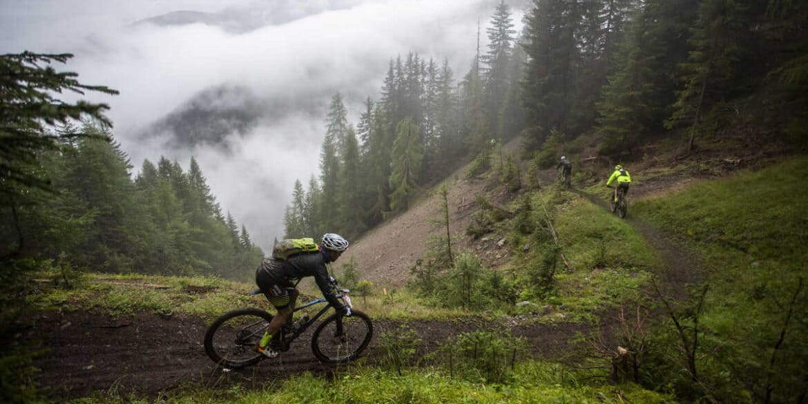 rider on muddy singletrack