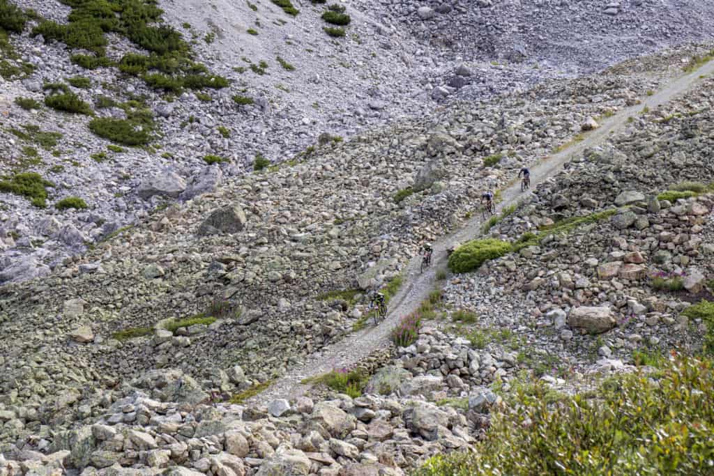 riders on rocky mountain road